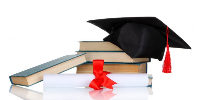 Grad hat with diploma and books isolated on white